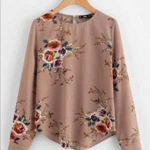 Floral print curved hem blouse